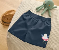 Kinder-Boardshorts, maritim